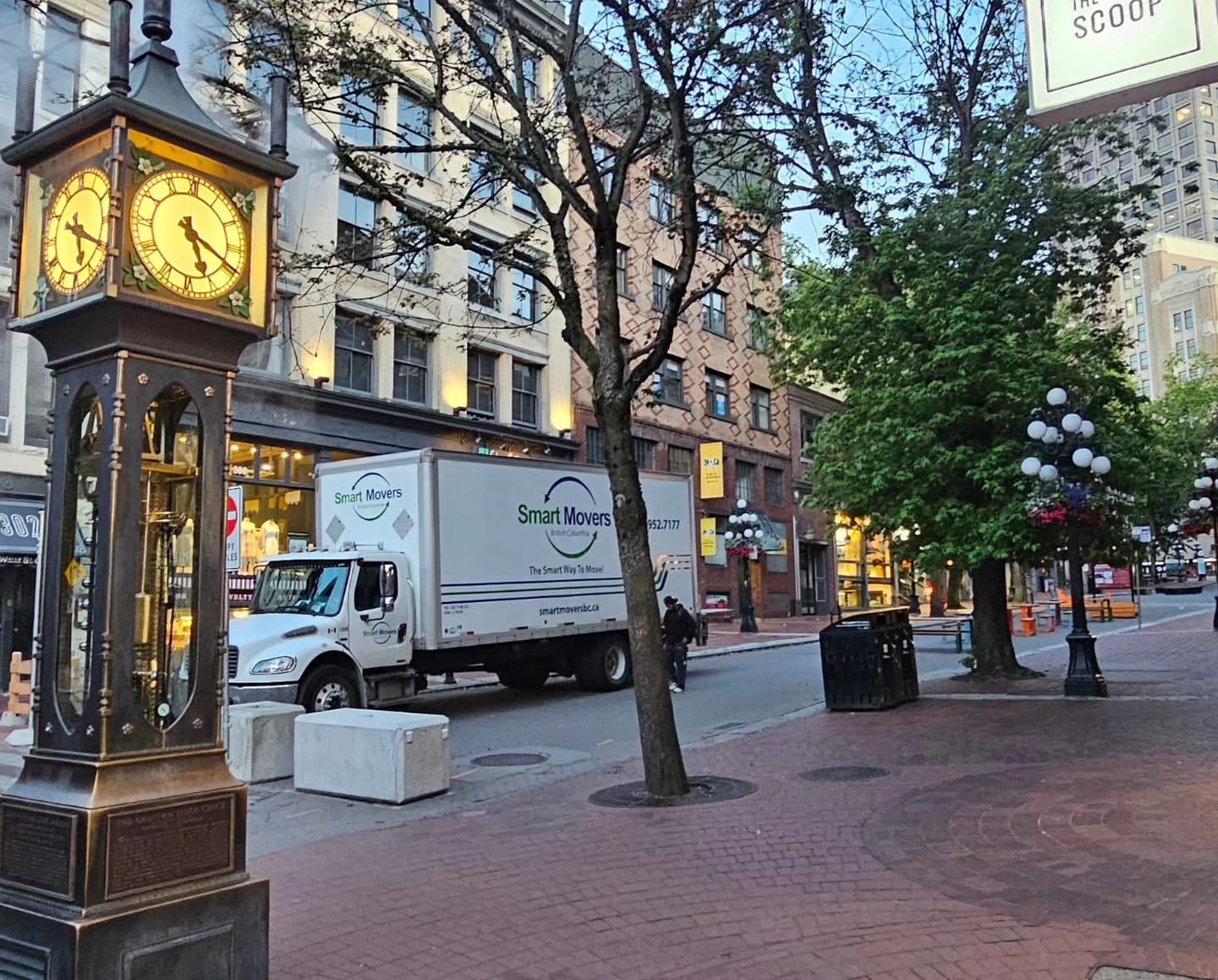 Commercial moving team preparing office furniture for transport
